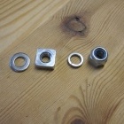 The sequence of washers and nuts to hold the dropper on the brake bridge (last one is a Nylock)