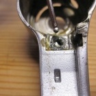 Having removed the long lever from the mechanism, this screw plate had to be accounted for