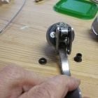 Mechanism with hinge pin sleeves removed