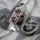 The rear derailleur as bought - the missing bolt etc., for clamping the shifter cable,is highlighted