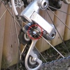 Here it is with chain etc fitted and the bolt/nut homemade clamp is illustrated - which works very well. And still a very cheap solution which now looks acceptable